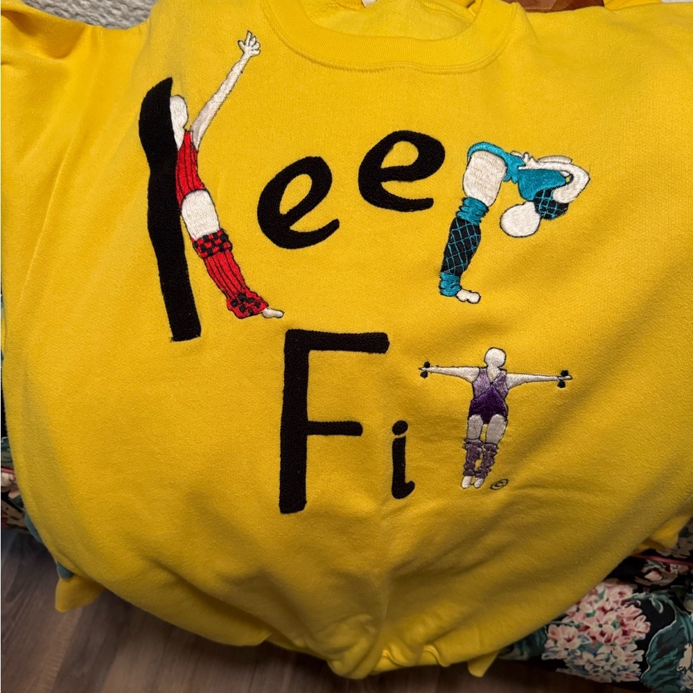 Shirlee designs Bright Yellow Embroidered Sweatshirt with Multicolor Stitching